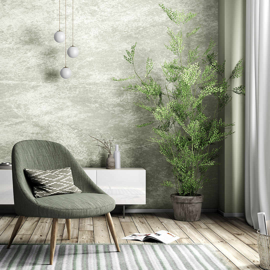 Soggiorno con mobile, poltrona e piante. Ad Architecture & Design arreda la tua casa